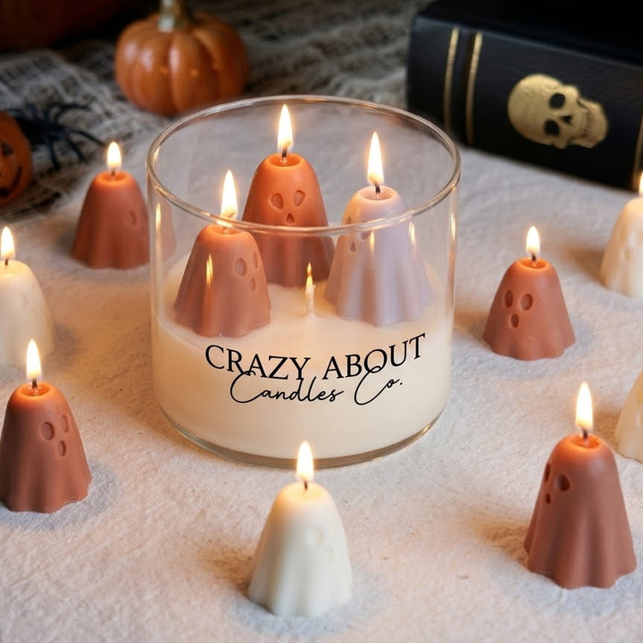 A glass jar candle labeled &