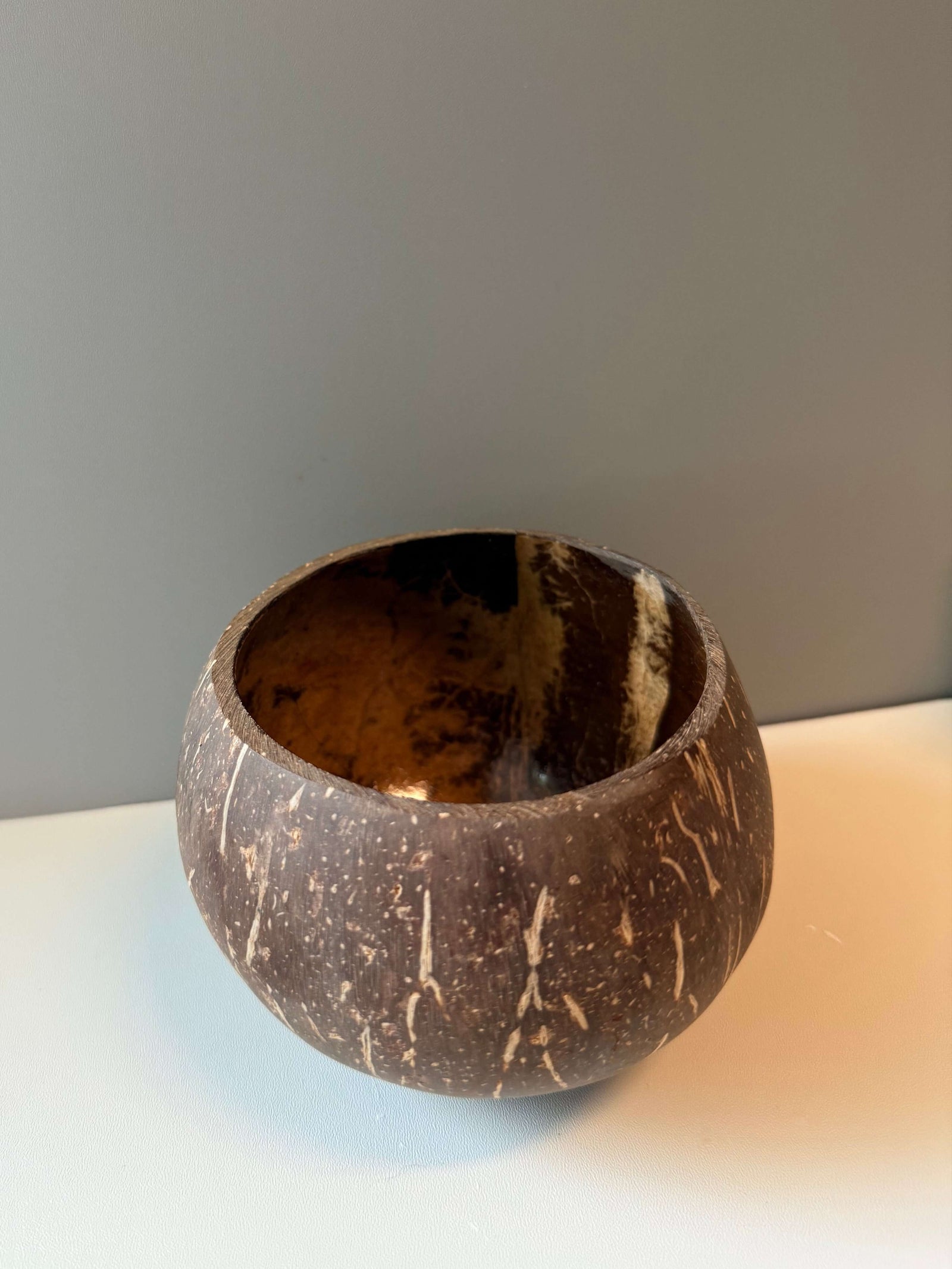 Handcrafted natural coconut shell bowl, perfect for DIY candle making or rustic home decor.