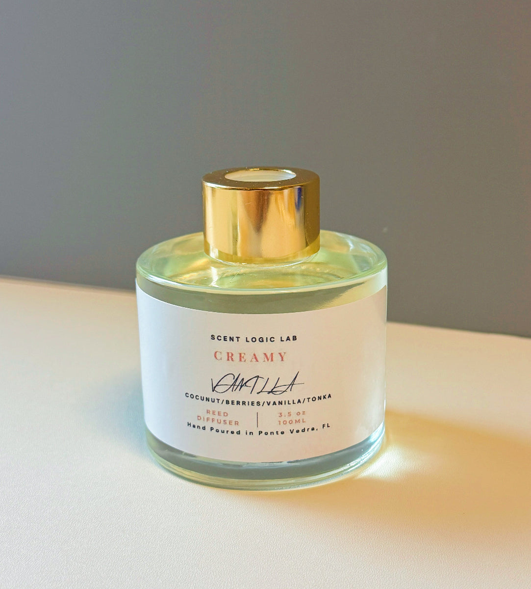 Creamy Vanilla Reed Diffuser bottle with gold cap, hand-poured in Ponte Vedra, FL, perfect for cozy ambiance.