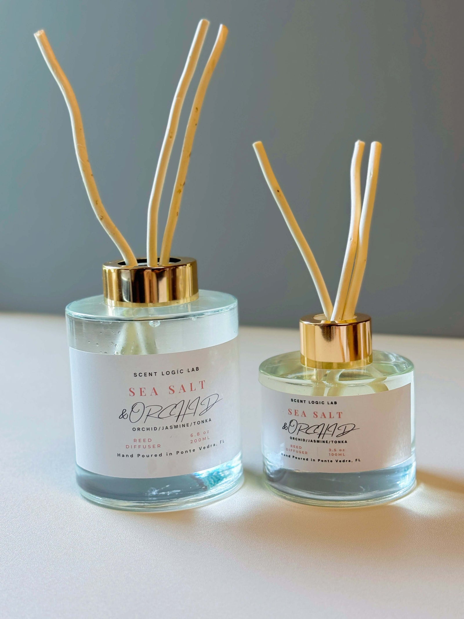 Sea Salt and Orchid Reed Diffuser in 100ml and 200ml sizes, hand-poured aroma for home decor.