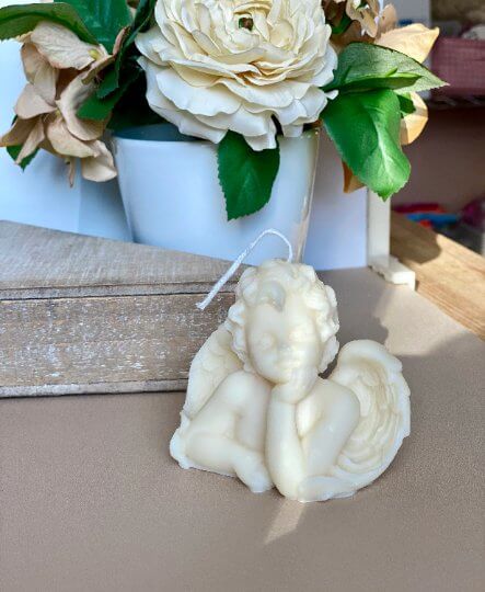 Artistic angel figure candle in pastel color