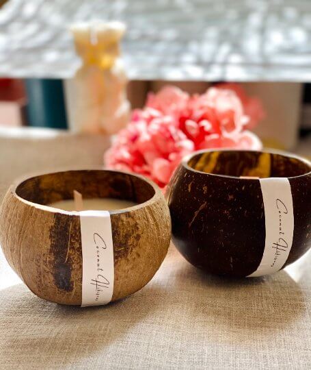 Handmade candle in coconut shell bowl