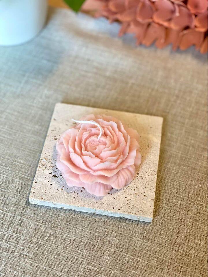 Peony-scented decorative candle