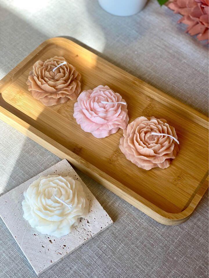 Scented candle shaped like a peony
